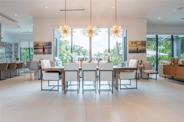 tiled dining space with an inviting chandelier