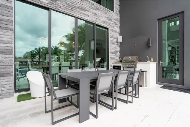 view of patio featuring grilling area and sink