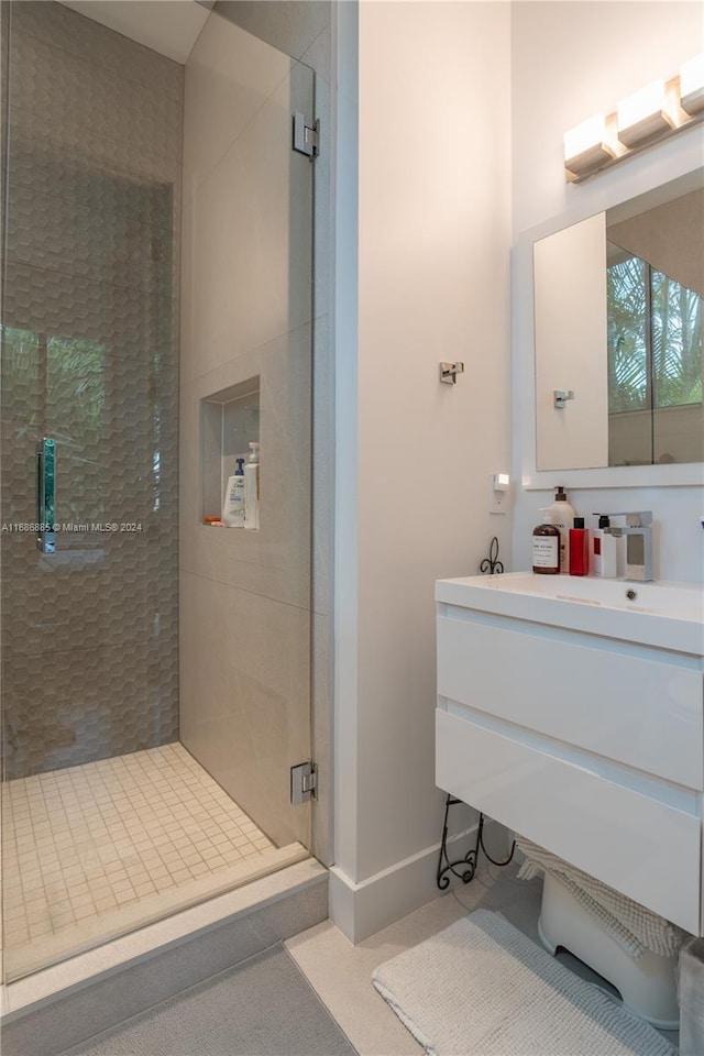 bathroom with vanity and an enclosed shower