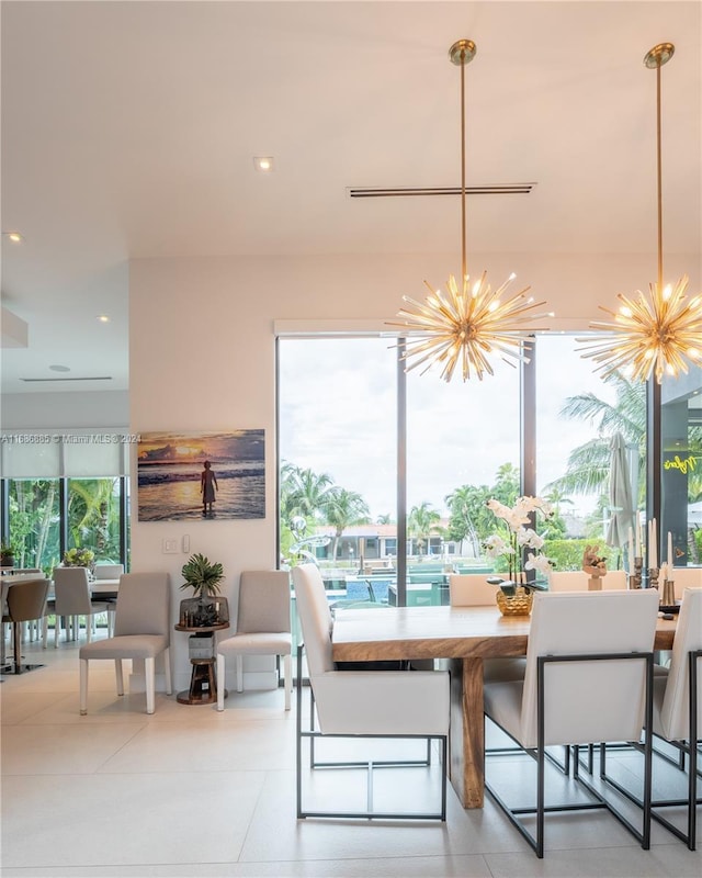 dining space featuring an inviting chandelier and a wealth of natural light