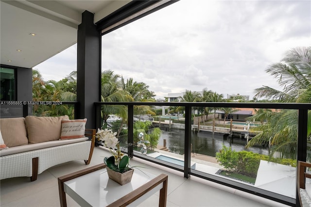 balcony featuring a water view