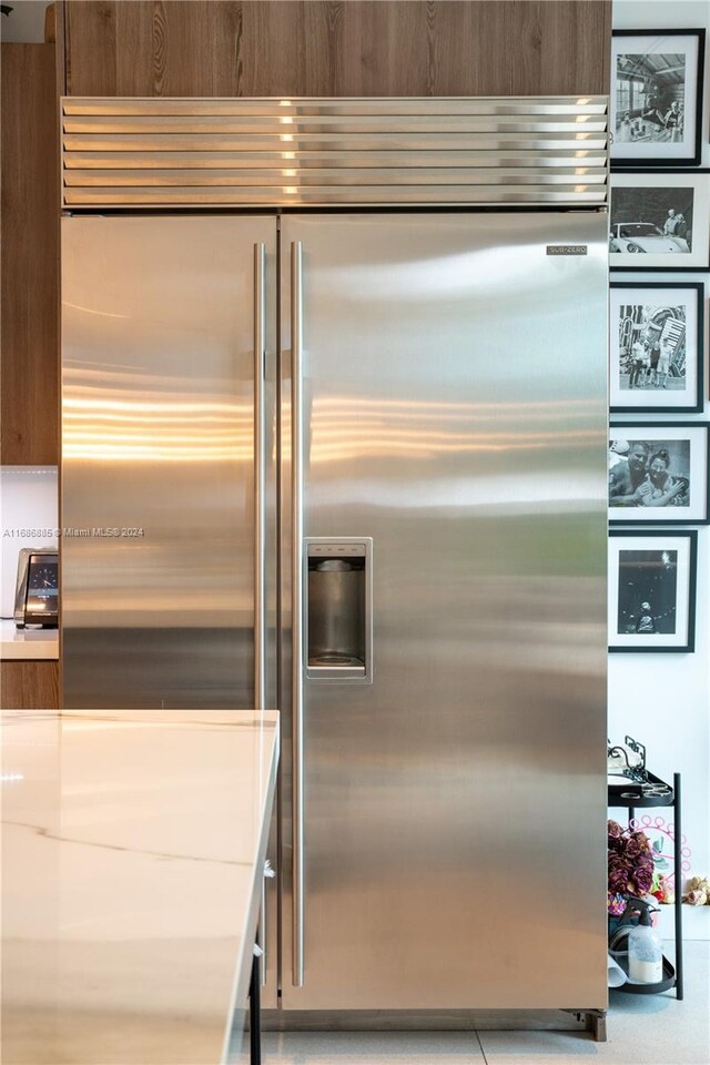 kitchen featuring stainless steel built in fridge