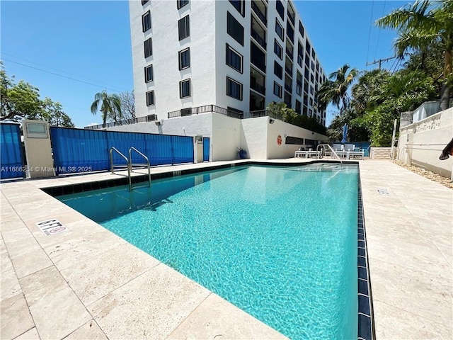 view of swimming pool with a patio