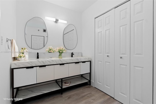 bathroom featuring vanity and wood-type flooring