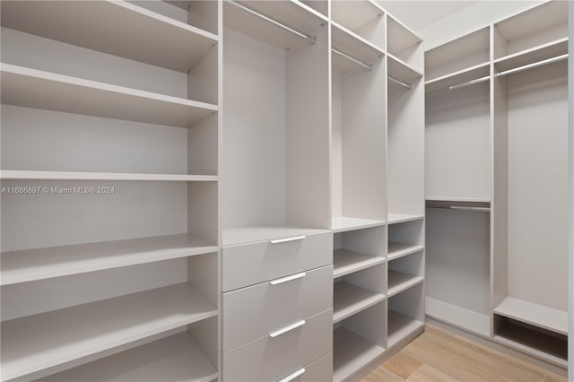 walk in closet featuring light hardwood / wood-style floors