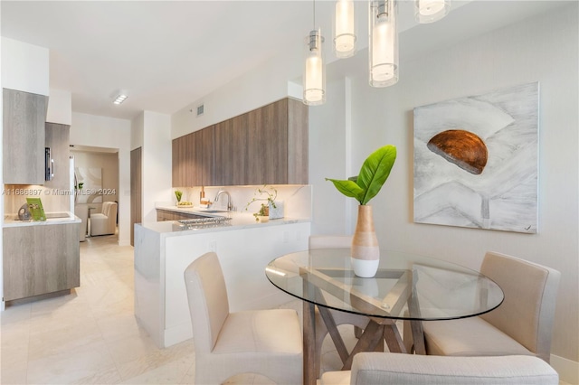 dining area featuring sink