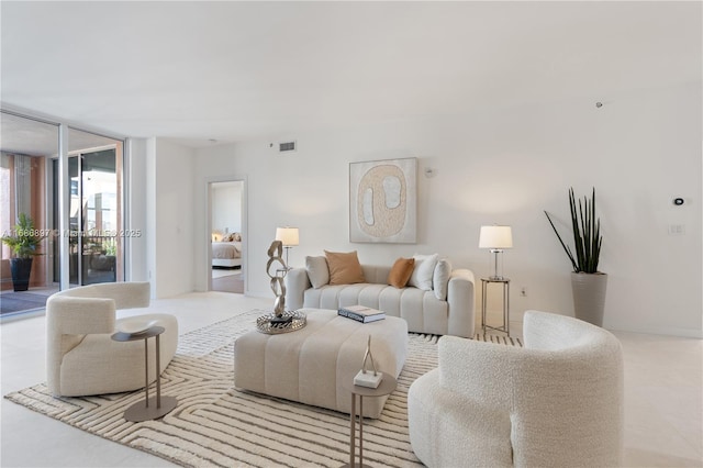 living room featuring visible vents