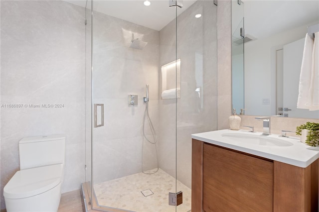 bathroom with vanity, toilet, and walk in shower