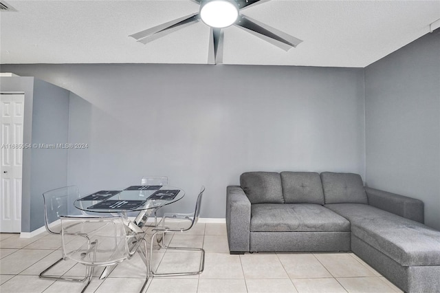 interior space with a textured ceiling and ceiling fan