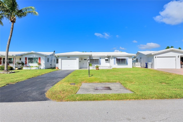 single story home with a front lawn and a garage