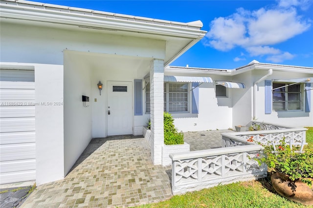 entrance to property featuring a garage