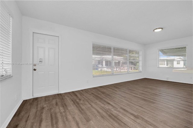 interior space with dark hardwood / wood-style flooring