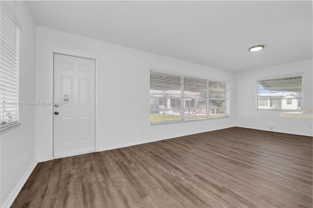 2851 W Golf Blvd, Pompano Beach, FL 33064 - unfurnished room featuring wood finished floors and baseboards