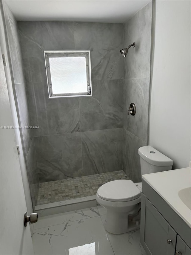 2851 W Golf Blvd, Pompano Beach, FL 33064 - bathroom featuring marble finish floors, toilet, and a stall shower