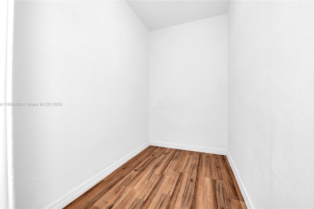 unfurnished room with wood-type flooring