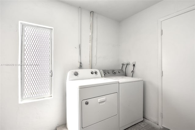 washroom featuring washer and clothes dryer