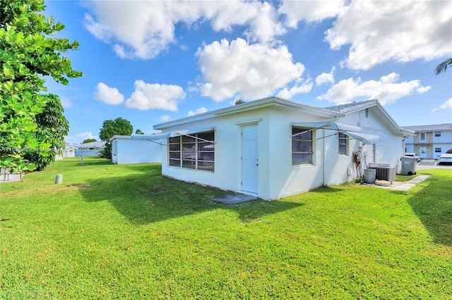 2851 W Golf Blvd, Pompano Beach, FL 33064 - view of home's exterior featuring stucco siding and a lawn