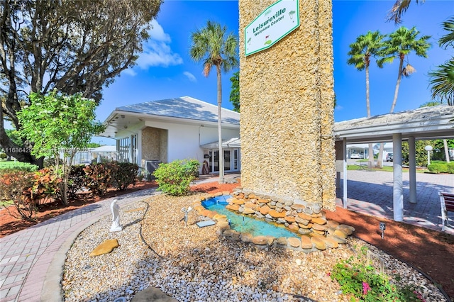 2851 W Golf Blvd, Pompano Beach, FL 33064 - rear view of property featuring stucco siding