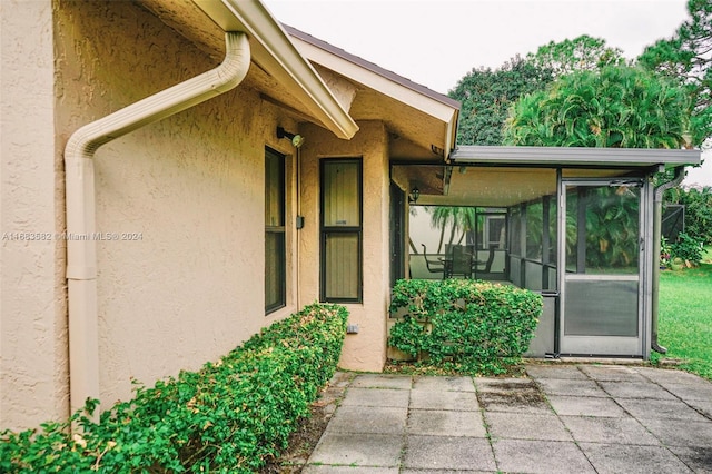 entrance to property featuring a patio area