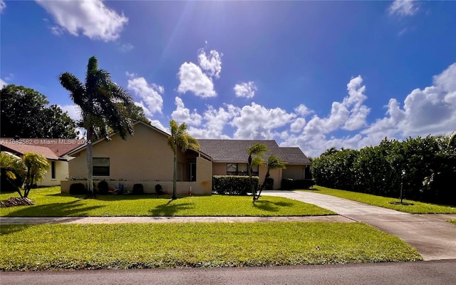 single story home with a front yard