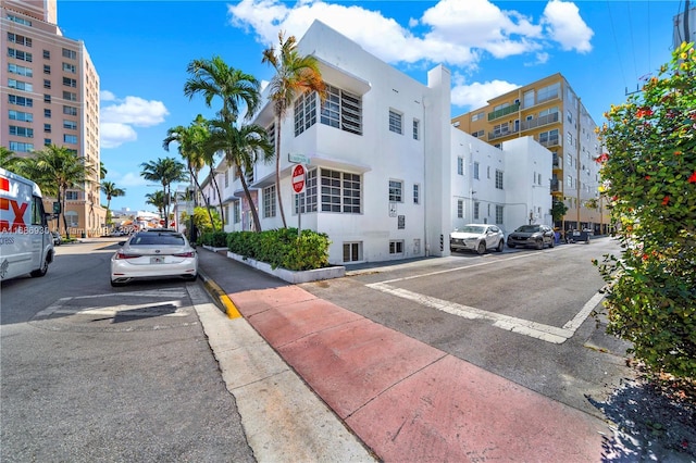 610 8th St Unit 102, Miami Beach, FL 33139 - view of asphalt road featuring traffic signs, sidewalks, and street lights