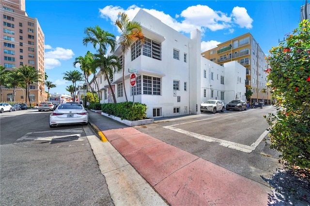 610 8th St Unit 102, Miami Beach, FL 33139 - view of asphalt street with traffic signs, sidewalks, street lighting, and curbs