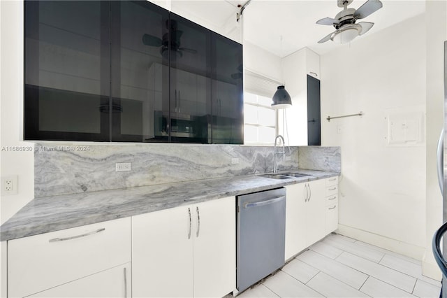 kitchen featuring white cabinetry, sink, and stainless steel dishwasher