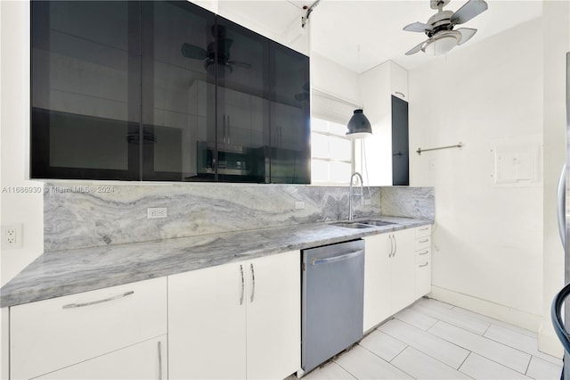 610 8th St Unit 102, Miami Beach, FL 33139 - kitchen featuring stainless steel dishwasher, a ceiling fan, backsplash, white cabinets, and light stone countertops