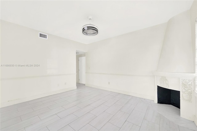 610 8th St Unit 102, Miami Beach, FL 33139 - spare room with a fireplace and baseboards