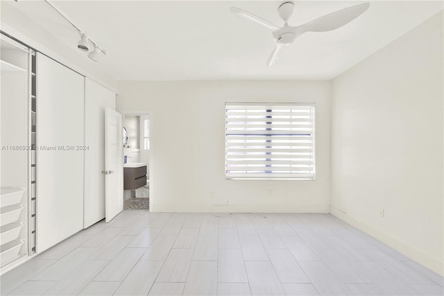 610 8th St Unit 102, Miami Beach, FL 33139 - unfurnished bedroom with ceiling fan, a closet, and track lighting