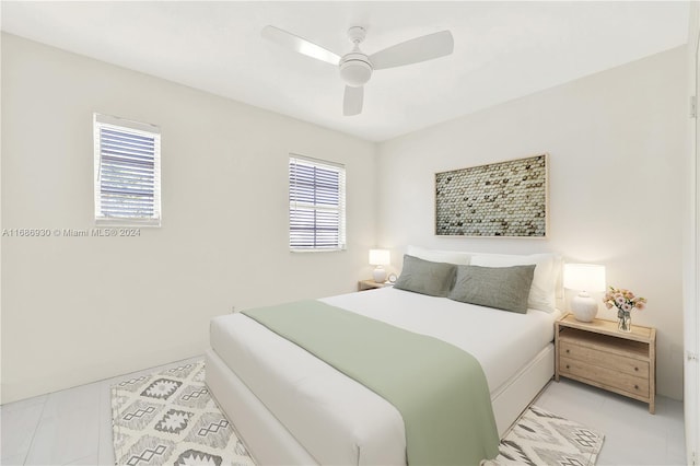 610 8th St Unit 102, Miami Beach, FL 33139 - bedroom with multiple windows, light tile patterned floors, and ceiling fan