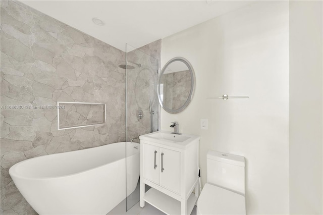 bathroom featuring vanity, toilet, tile walls, and a bathing tub