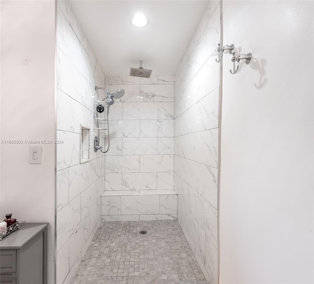 bathroom with tiled shower