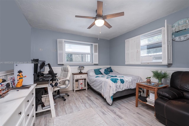 bedroom featuring ceiling fan and light hardwood / wood-style flooring