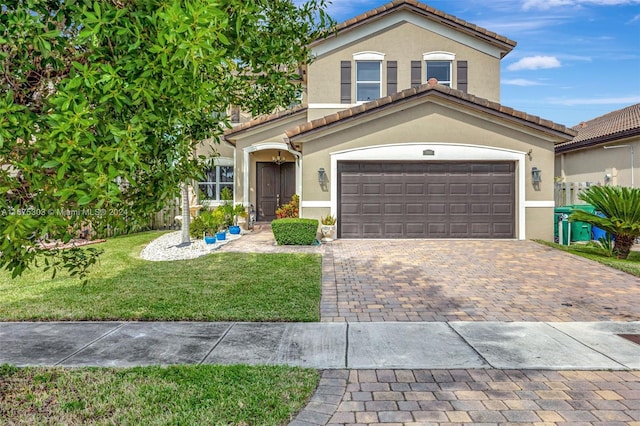 mediterranean / spanish-style house with a front yard and a garage