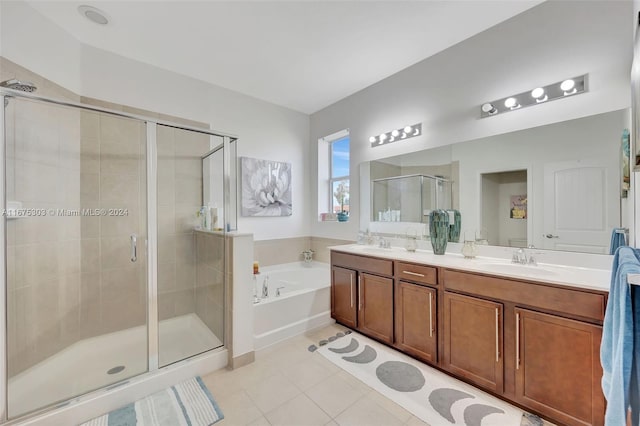 bathroom featuring tile patterned floors, plus walk in shower, and vanity