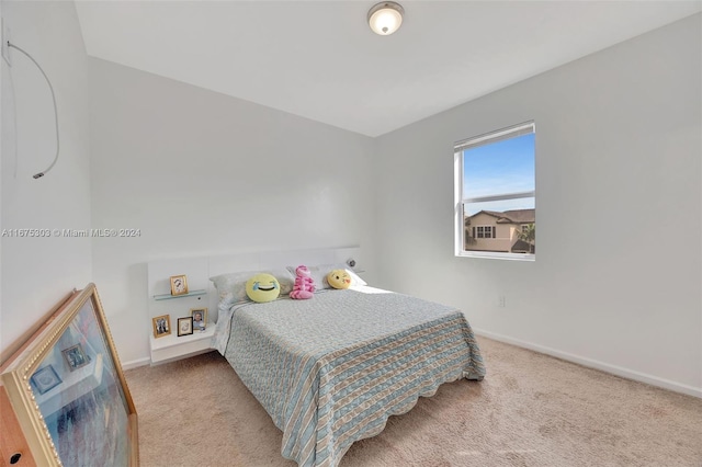 bedroom with light carpet