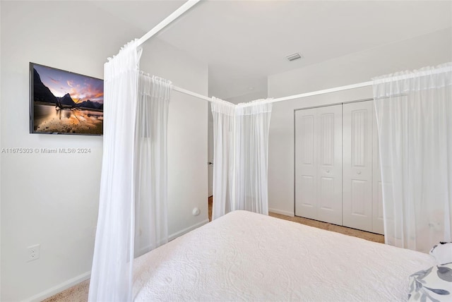 bedroom with a closet and carpet floors