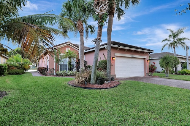 view of front of house featuring a front yard and a garage