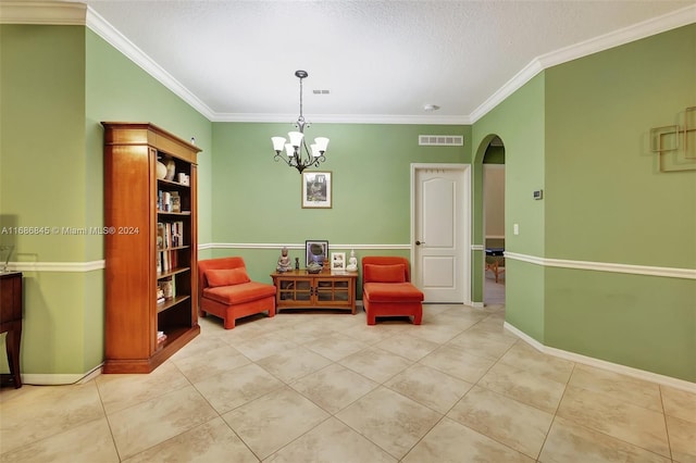 sitting room with a notable chandelier, ornamental molding, and a textured ceiling