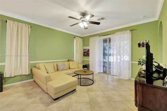 living room featuring crown molding, light tile patterned floors, and ceiling fan