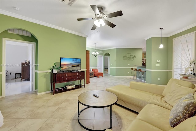 living room featuring crown molding, light tile patterned flooring, and ceiling fan with notable chandelier