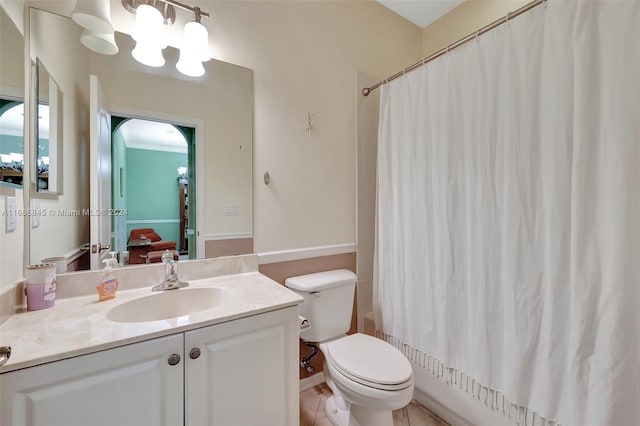 full bathroom with vanity, shower / tub combo, ornamental molding, and toilet