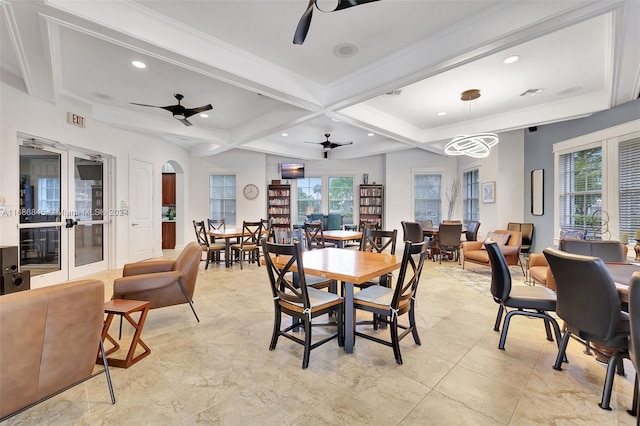 dining area featuring beam ceiling, coffered ceiling, crown molding, and ceiling fan