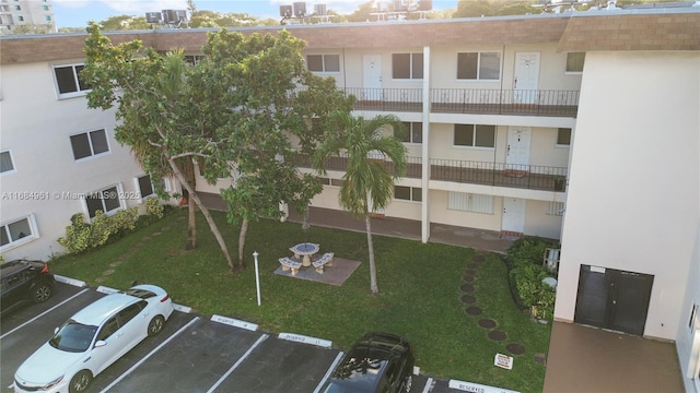 view of building exterior featuring uncovered parking