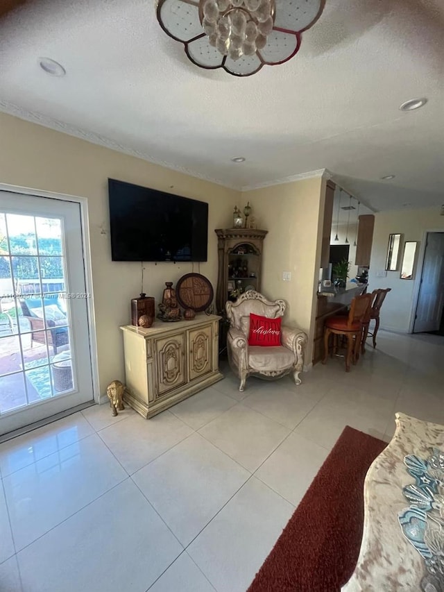 tiled living room featuring a textured ceiling