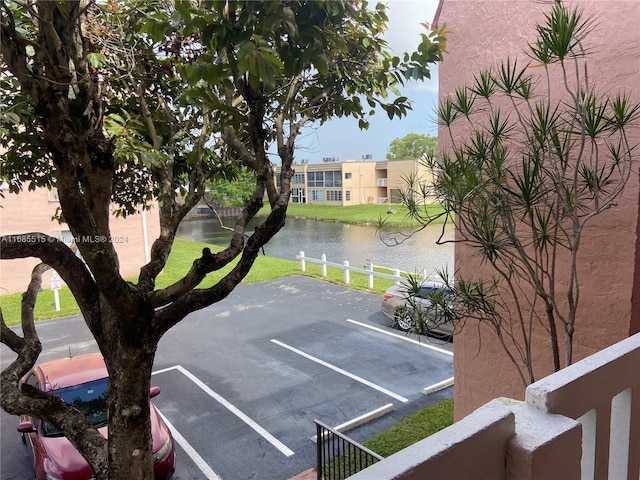 view of parking featuring a water view