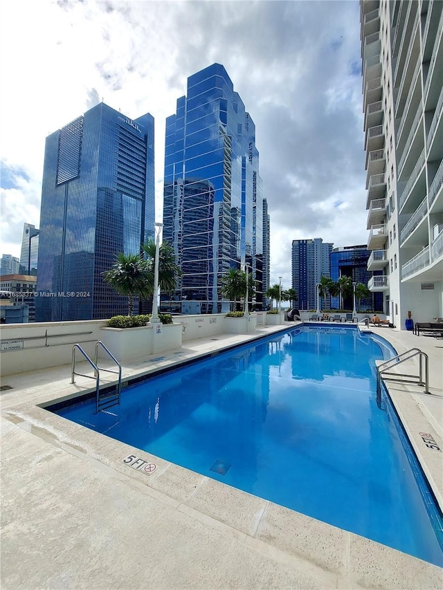 view of swimming pool with a patio area