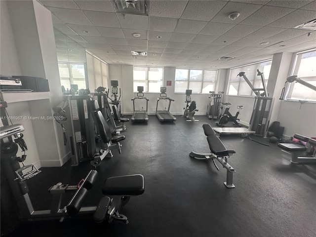 workout area with a paneled ceiling