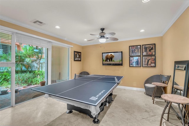 playroom featuring crown molding, a healthy amount of sunlight, and ceiling fan